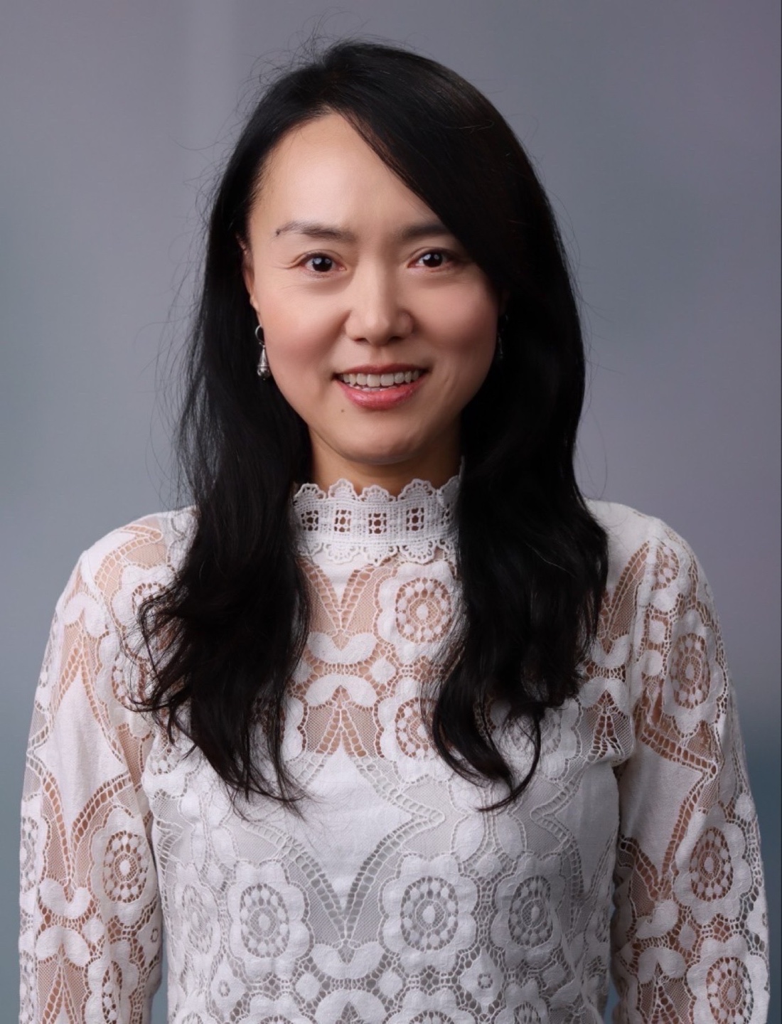 Smiling in white blouse