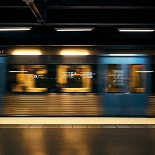 Blurred blue and yellow subway car