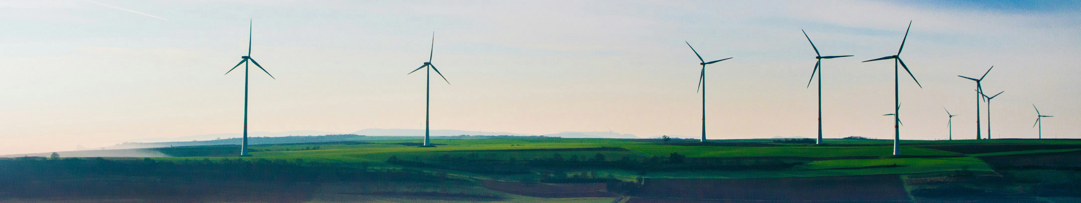 windmills on green field